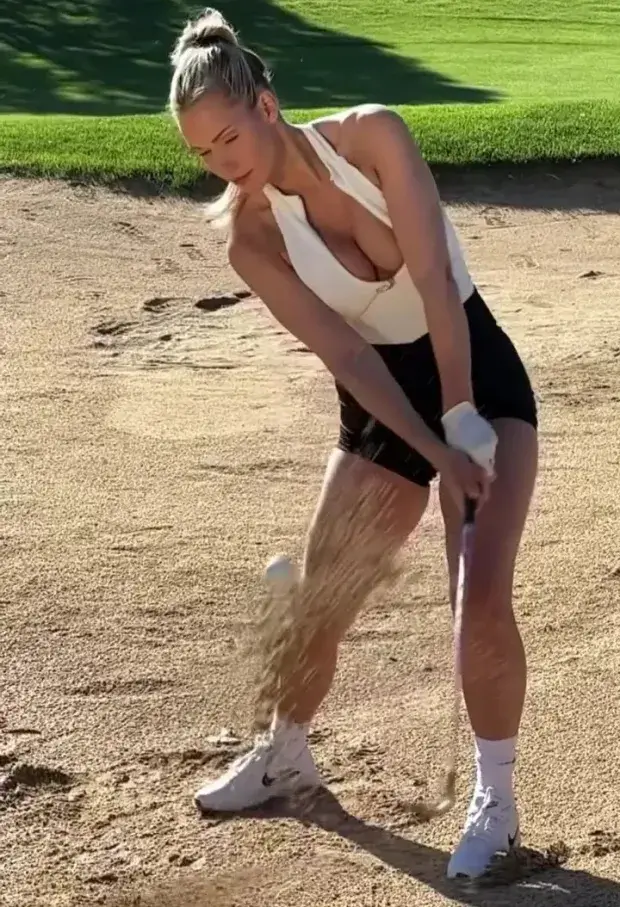 Followers were stunned when Paige Spiranac posted a slow-motion video of her chipped a ball out of a bunker in a low-cut white top.