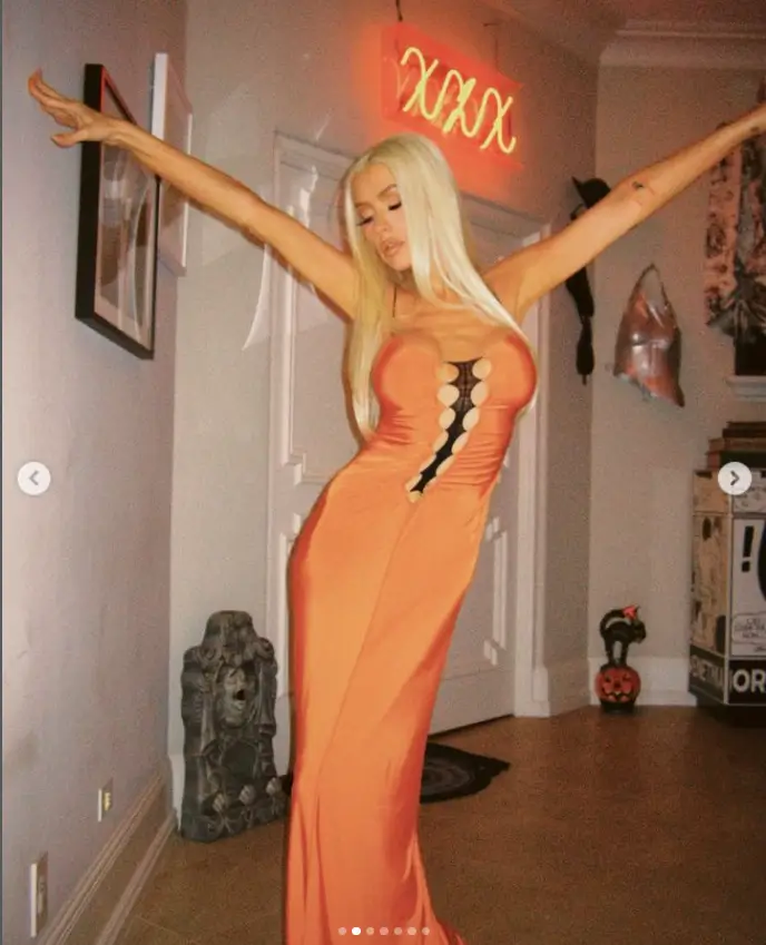 Christina Aguilera looked fantastic in her figure-hugging dress as she posed in bright fluorescent lighting. She also shared her Halloween decor.