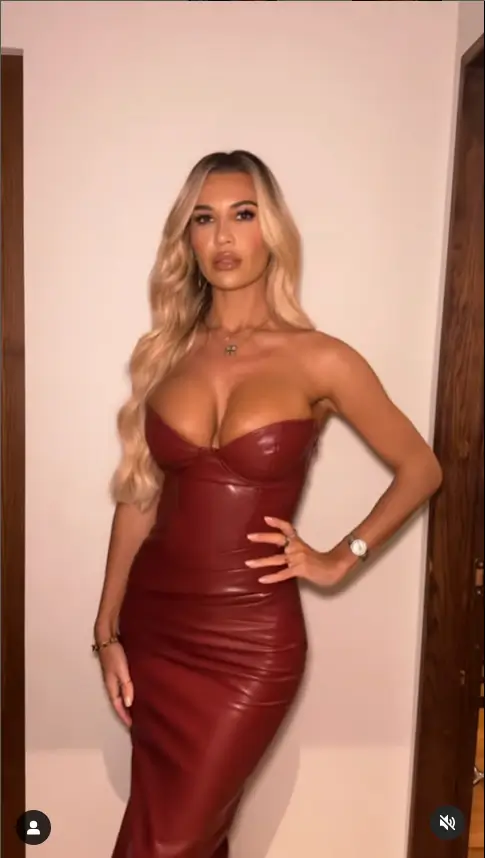 Christine McGuinness shows off her jaw-dropping figure in a figure-hugging burgundy dress as she poses for a sizzling mirror selfie