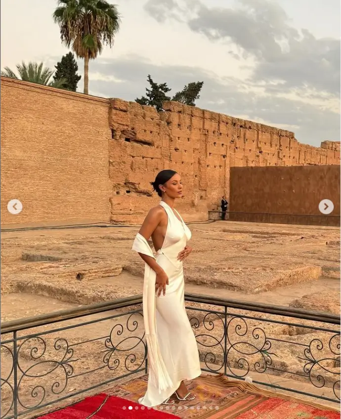 In a figure-hugging white satin gown, Maya Jama looks fantastic at a glam fashion event in Marrakech