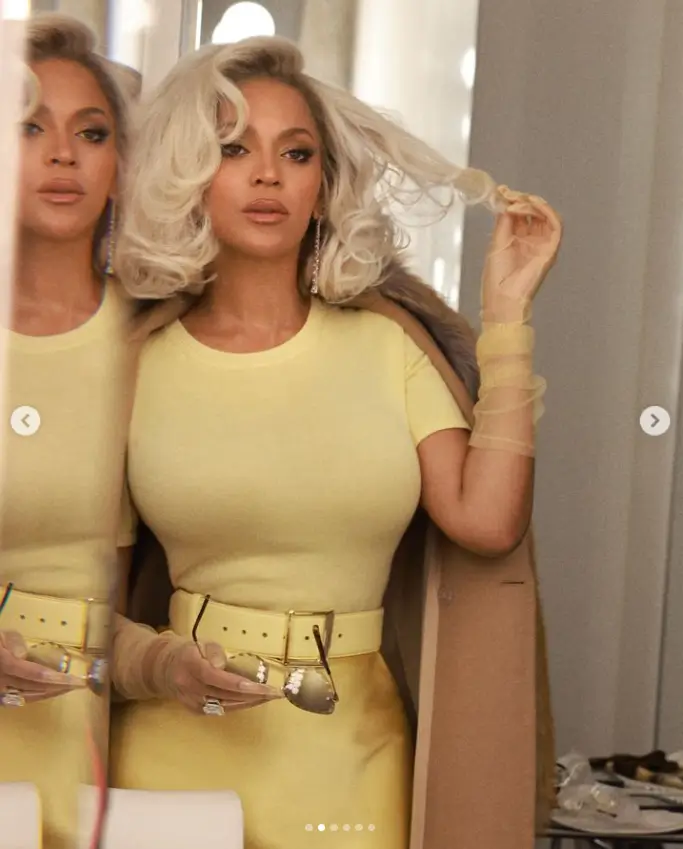 Taking to Instagram to share behind-the-scenes photos, Beyonce cut a glitzy figure in a figure-hugging top and matching satin skirt as she posed for fans.