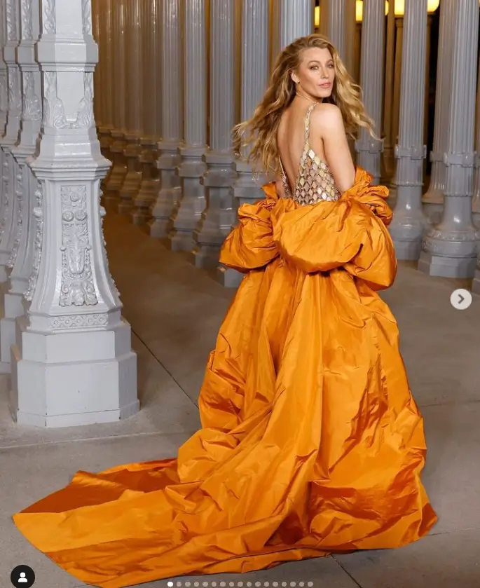 In an orange cape and diamond chainmail mini dress by Tamara Ralph, Blake Lively showed off her sartorial prowess at 2024 LACMA Art And Film Gala in Los Angeles over the weekend.