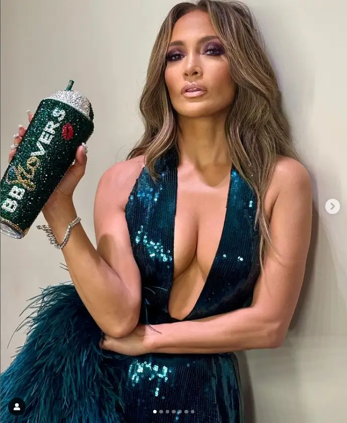 At a party to celebrate Elie Saab's 45th anniversary, Jennifer Lopez clutched a gem-encrusted "Beyond Beautiful" soft drinks beaker from her fans' group, the BBJLovers.