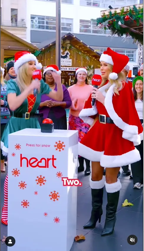 In honor of Heart Breakfast's Christmas celebrations, Amanda Holden and Ashley Roberts took on the role of Santa Clause and an elf to kick off the festivities. Outside Heart HQ in London's Leicester Square, the presenting duo donned glamorous ensembles to make it snow.