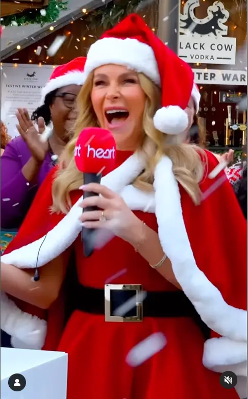 With her strapless red and white Santa mini dress, cape, and matching hat, Amanda Holden completed her stunning Christmas look with black knee-high heeled boots and dainty gold bracelets.