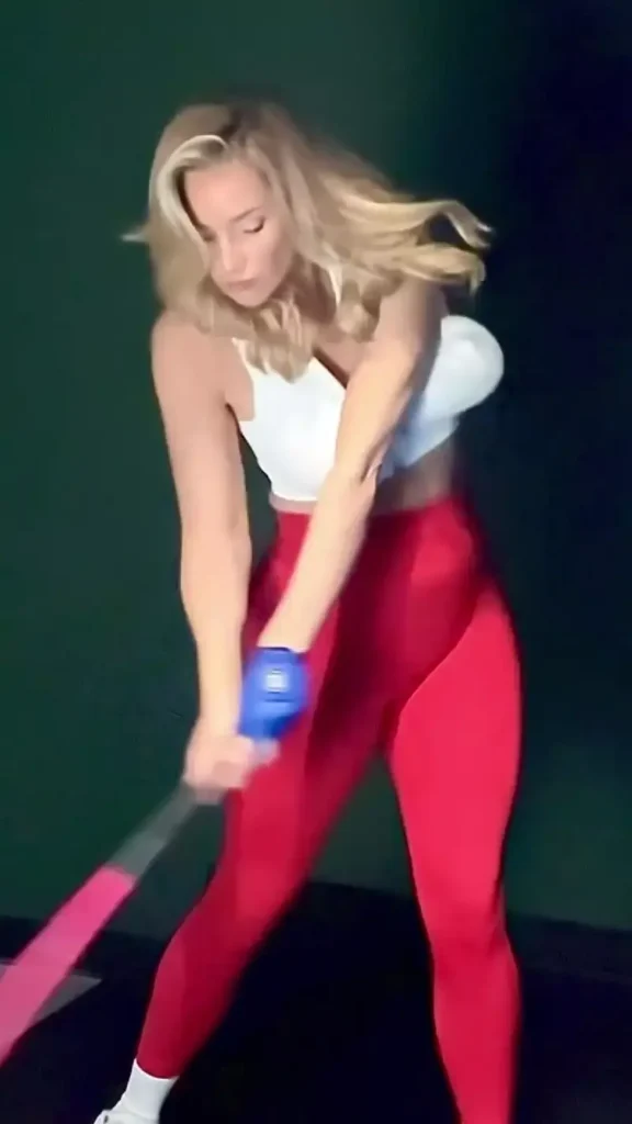 Paige Spiranac had a wardrobe malfunction as she uploaded a slow-motion video showing off her swing in an unzipped figure-hugging top