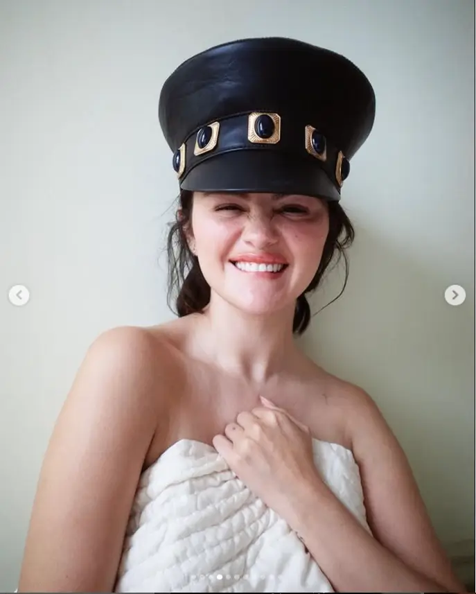 In one stunning photo, she is seen covered by an ivory blanket while wearing a black leather cap.