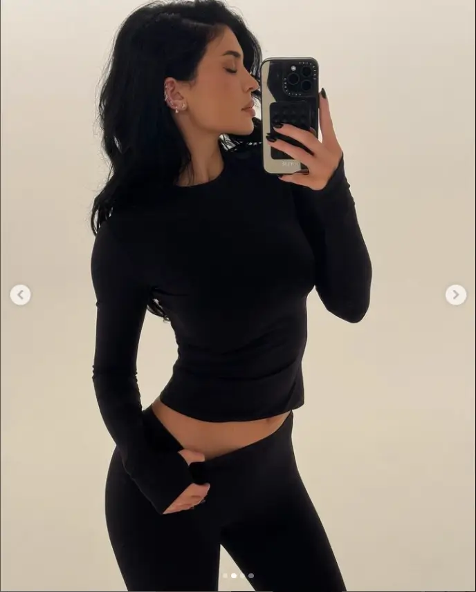 The new piercings shocked Kylie Jenner's fans as she flaunted her famous curves in a skintight crop top and matching leggings