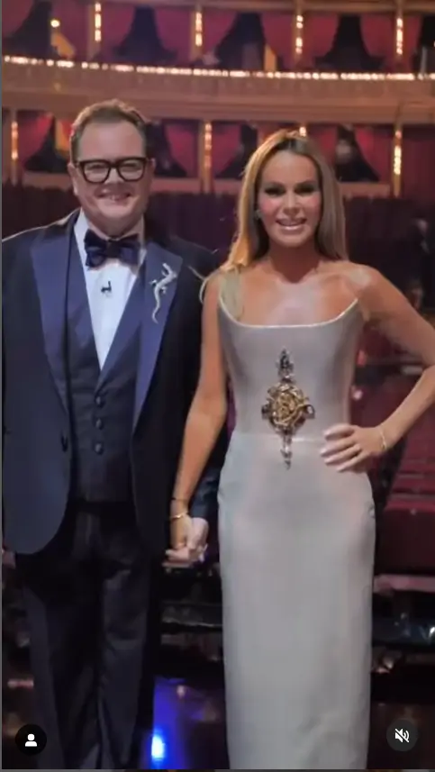 Amanda Holden shined in a gorgeous metallic strapless gown featuring a fitted bodice and a unique winged neckline at London's iconic Royal Albert Hall