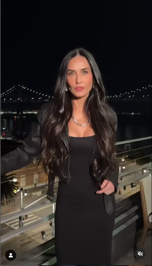 Demi Moore looked stunning as she showed off her radiant skin in a sleek black dress and matching denim jacket, both designed by GapStudio VP Zac Posen.