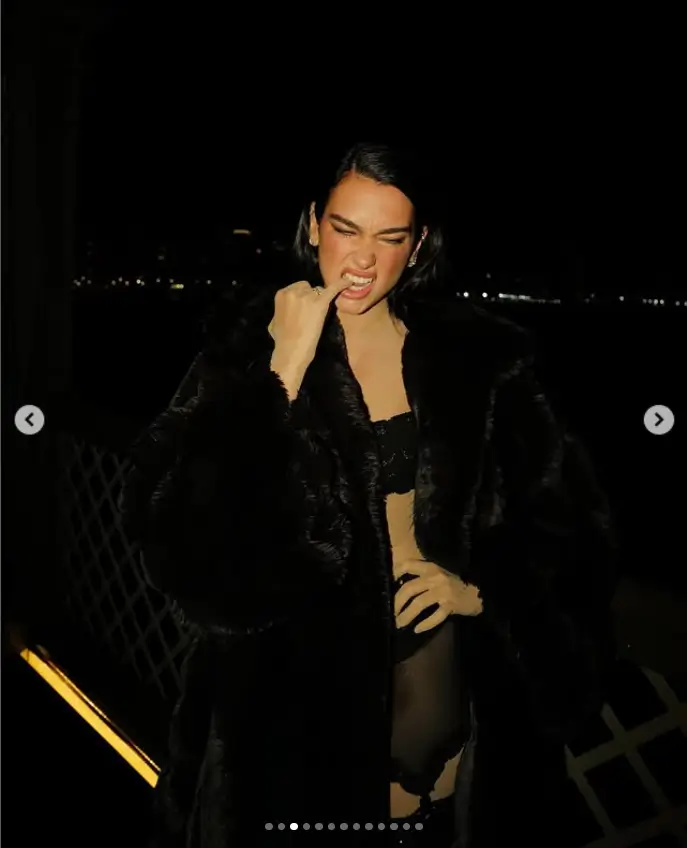 Dua Lipa dazzles in a series of steamy new photos, showcasing her stunning figure in nothing but stockings and a luxurious fur coat