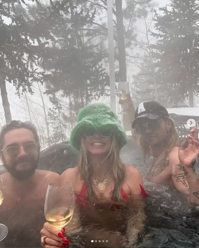 The America's Got Talent star had a wonderful time in the tub with her husband Tom Kaulitz and his twin brother Bill. As snowflakes fell around them, they enjoyed frolicking in the bubbling hot water.