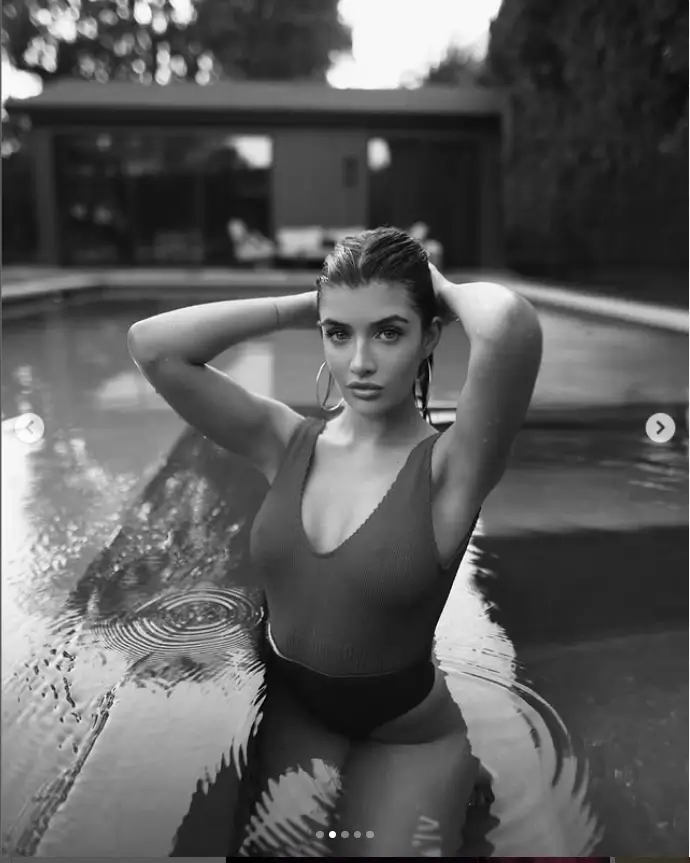 Sami Sheen made a stunning display of her curves while posing by the swimming pool at her luxurious Los Angeles mansion on Thursday, wearing a revealing swimsuit that left little to the imagination.