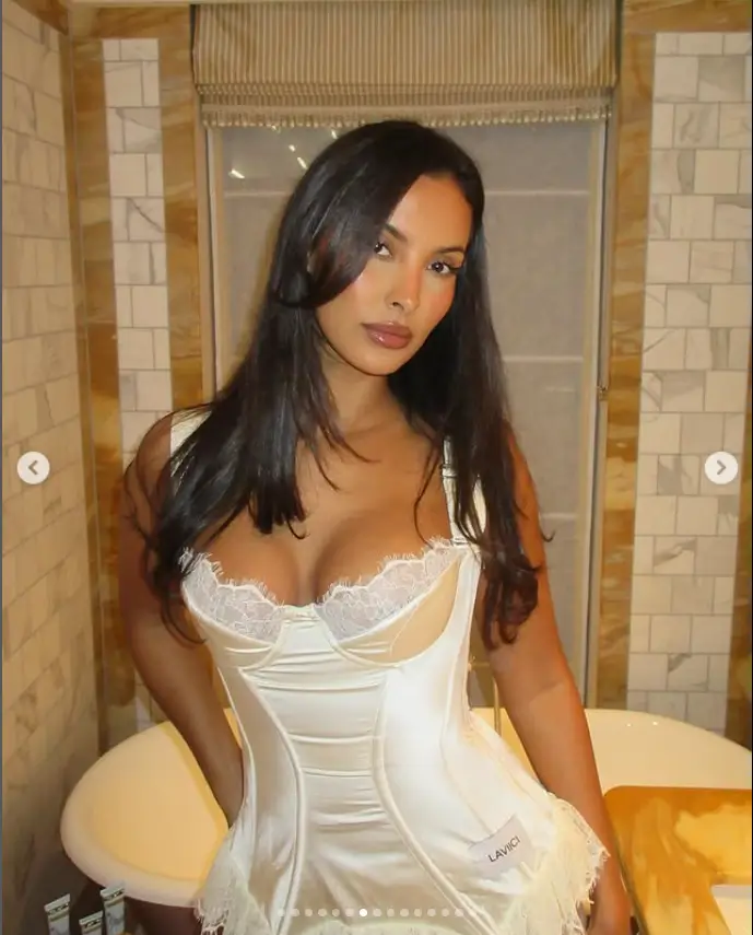 Strutting in a sultry white satin corset dress, Maya Jama turned up the heat and raised the temperatures at her festive Christmas party