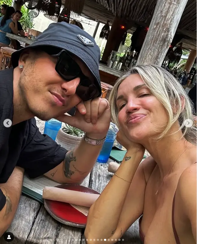 Later, Ashley and George decided to take a quick break from the beach and headed to a cozy beach bar. As they enjoyed some lunch, George rocked his stylish Prada bucket hat and the couple couldn't resist taking a sweet selfie together.