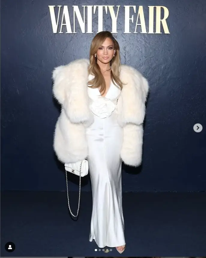 Dazzling and glamorous, the 55-year-old actress stole the show in a plunging silky white halter dress at the star-studded soiree. The silky fabric hugged her curves beautifully, making her the center of attention all night long.