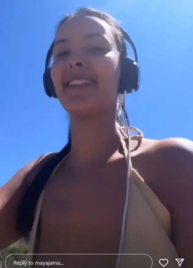 Braless Maya Jama looked stunning in a plunging beige dress while filming herself on a wholesome bike ride in the beautiful South Africa