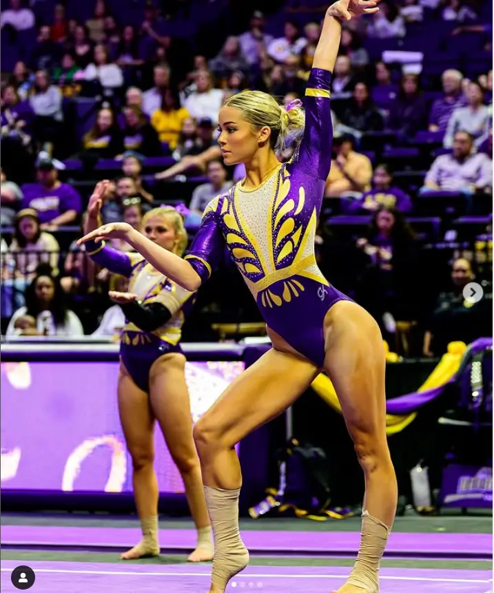 Dazzling her fans with a powerful performance, Dunne stood out in a breathtaking purple and gold "Wonder Woman" leotard, skillfully designed by GK Elite.