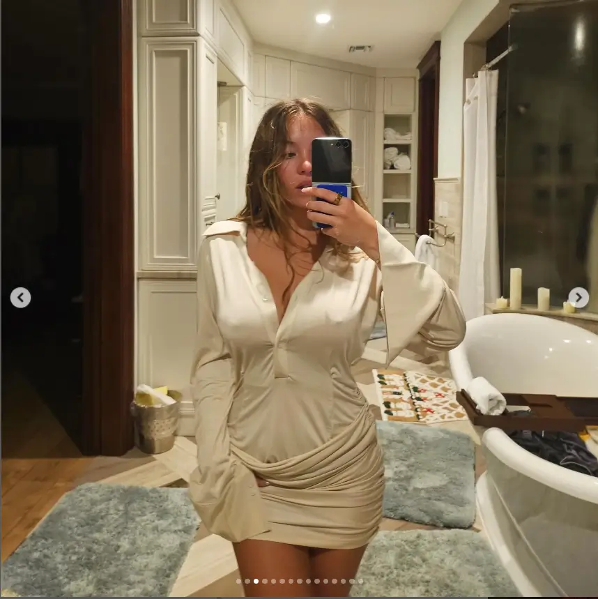 Among the various images shared, one captured her in a white minidress taking a mirror selfie