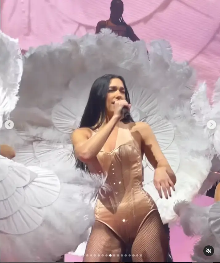 The singer dazzled in a stunning one-piece outfit paired with fishnet tights and sparkling silver knee-high boots. Dua's performance was elevated as she flaunted her enviable figure while grooving on stage in the eye-catching and provocative ensemble.